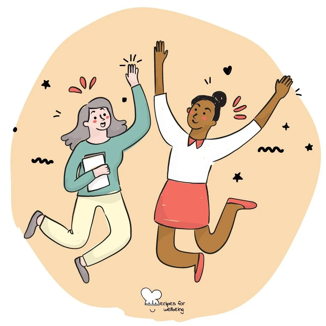 Two people jumping with their arms in the air