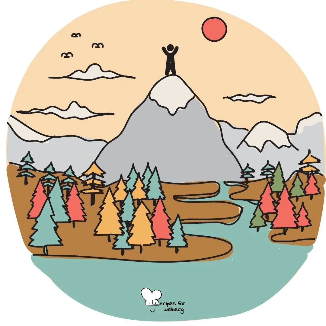 A small figure standing on a mountain summit under a red sun