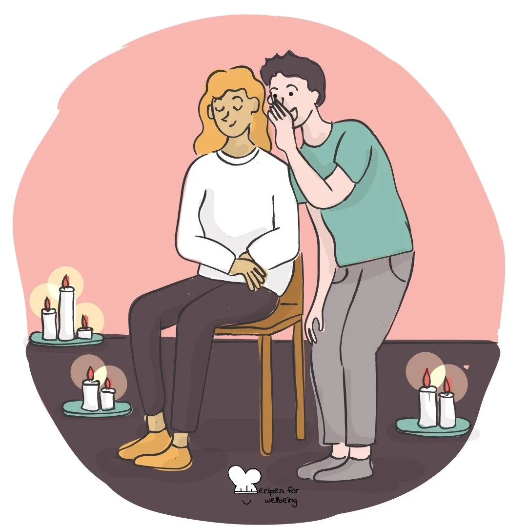 One person leaning in to whisper to another, candles around them
