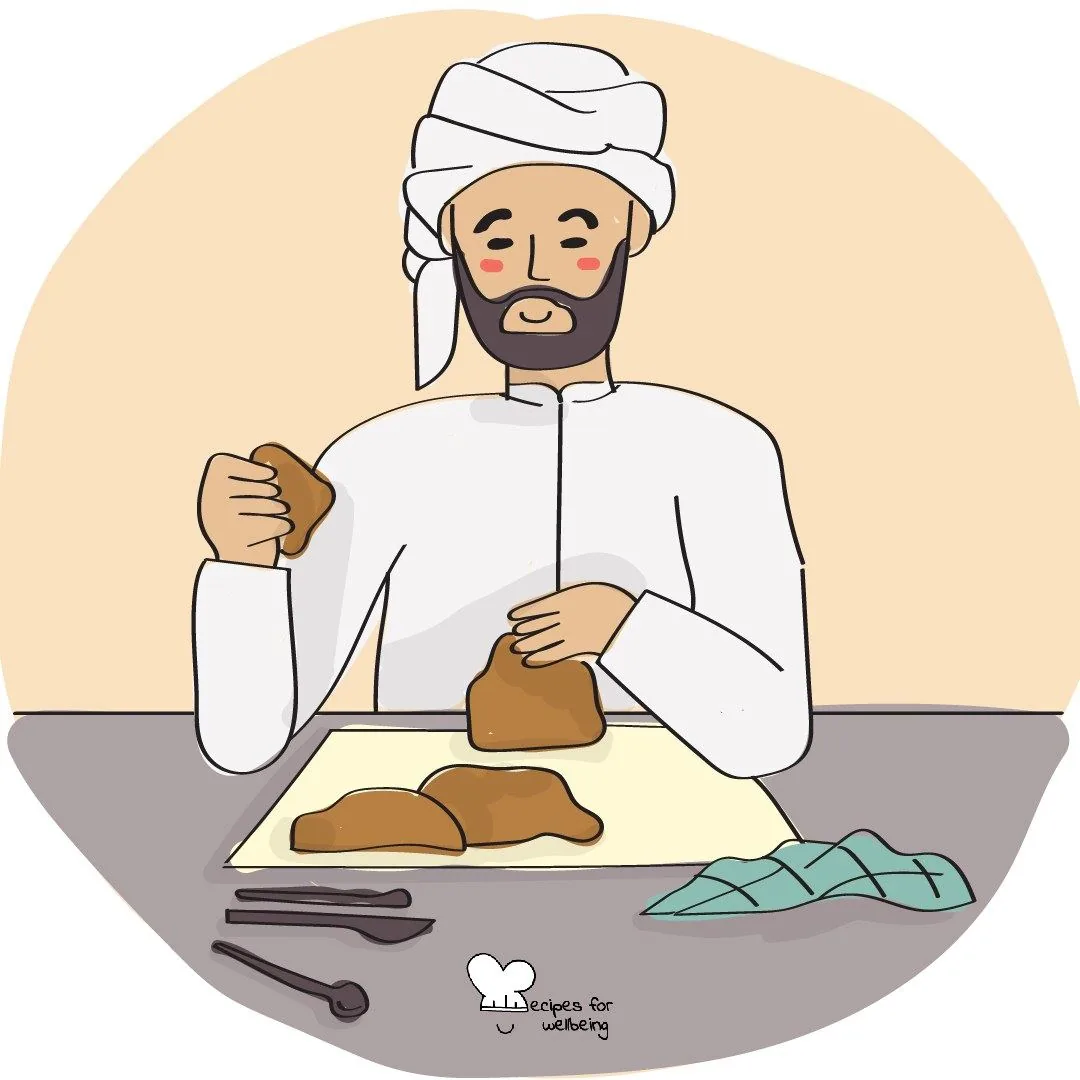 A person shaping a lump of clay with both hands