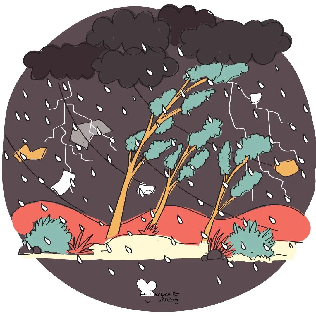 Trees bending under dark clouds in a rainstorm